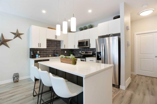 561 Canals Crossing Sw, Airdrie, AB - Indoor Photo Showing Kitchen With Upgraded Kitchen