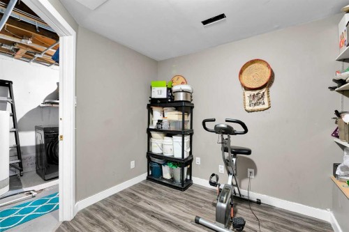 802-919 38 Street Ne, Calgary, AB - Indoor Photo Showing Gym Room