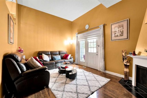 802-919 38 Street Ne, Calgary, AB - Indoor Photo Showing Living Room With Fireplace