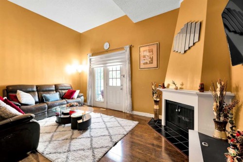 802-919 38 Street Ne, Calgary, AB - Indoor Photo Showing Living Room With Fireplace