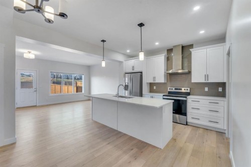 1489 Bayview Point Sw, Airdrie, AB - Indoor Photo Showing Kitchen With Stainless Steel Kitchen With Upgraded Kitchen