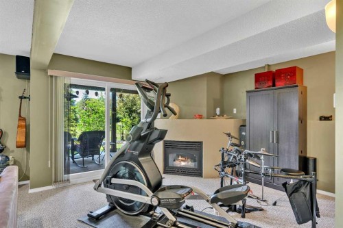 46 Somerside Manor Sw, Calgary, AB - Indoor Photo Showing Gym Room