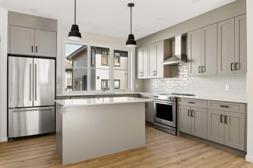 414-1453 Na'A Drive Sw, Calgary, AB - Indoor Photo Showing Kitchen With Upgraded Kitchen