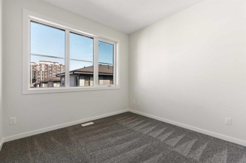 414-1453 Na'A Drive Sw, Calgary, AB - Indoor Photo Showing Other Room