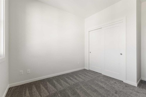 414-1453 Na'A Drive Sw, Calgary, AB - Indoor Photo Showing Other Room