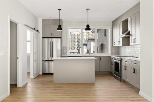 414-1453 Na'A Drive Sw, Calgary, AB - Indoor Photo Showing Kitchen With Upgraded Kitchen