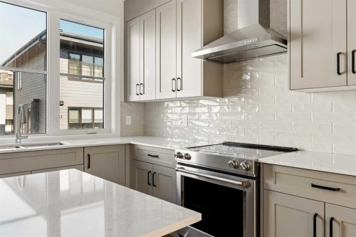 414-1453 Na'A Drive Sw, Calgary, AB - Indoor Photo Showing Kitchen With Double Sink With Upgraded Kitchen