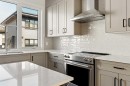 414-1453 Na'A Drive Sw, Calgary, AB  - Indoor Photo Showing Kitchen With Double Sink With Upgraded Kitchen 