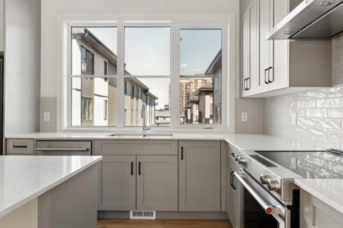 414-1453 Na'A Drive Sw, Calgary, AB - Indoor Photo Showing Kitchen