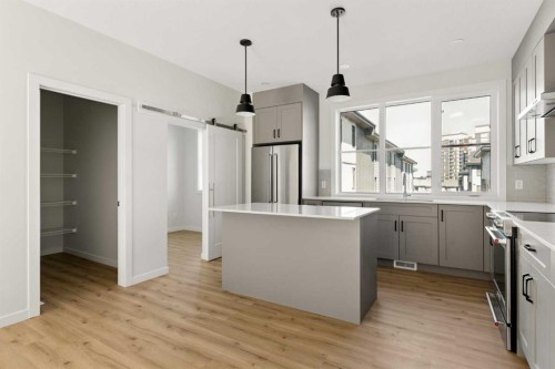 414-1453 Na'A Drive Sw, Calgary, AB - Indoor Photo Showing Kitchen With Upgraded Kitchen