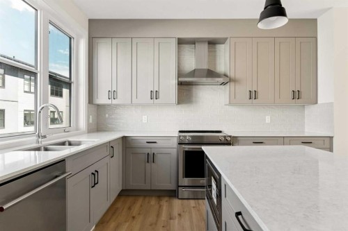 414-1453 Na'A Drive Sw, Calgary, AB - Indoor Photo Showing Kitchen With Upgraded Kitchen