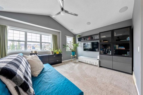64 Sunrise Terrace, Cochrane, AB - Indoor Photo Showing Bedroom