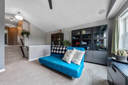 64 Sunrise Terrace, Cochrane, AB - Indoor Photo Showing Living Room
