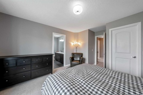 64 Sunrise Terrace, Cochrane, AB - Indoor Photo Showing Bedroom