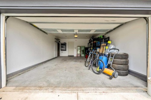 64 Sunrise Terrace, Cochrane, AB - Indoor Photo Showing Garage