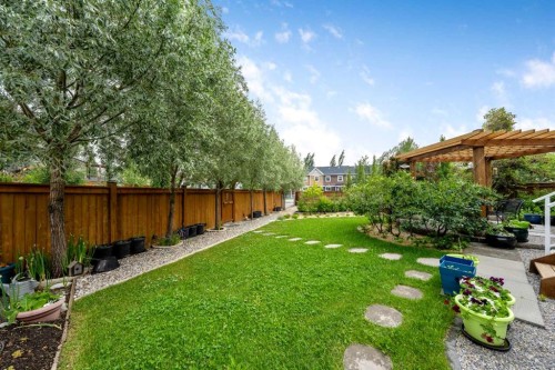 64 Sunrise Terrace, Cochrane, AB - Outdoor With Backyard