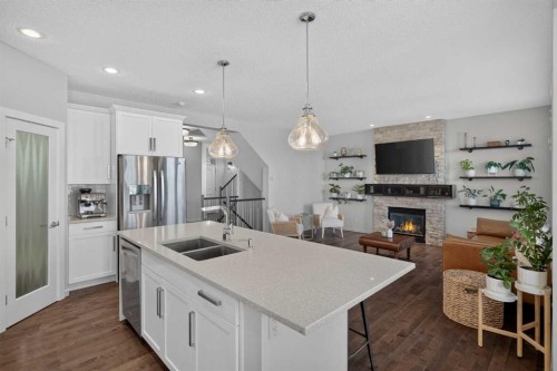 367 Mahogany Terrace Se, Calgary, AB - Indoor Photo Showing Kitchen With Fireplace With Double Sink With Upgraded Kitchen