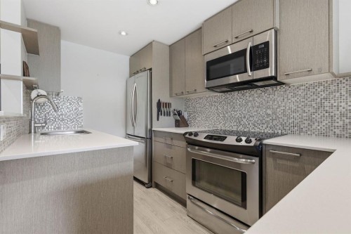 403-916 Memorial Drive Nw, Calgary, AB - Indoor Photo Showing Kitchen With Upgraded Kitchen