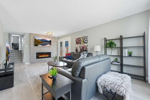 55 Sunbank Road Se, Calgary, AB - Indoor Photo Showing Living Room With Fireplace