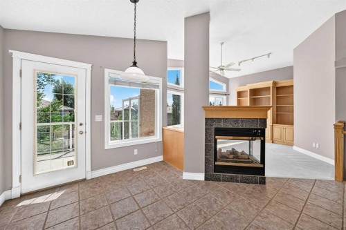 311 Royal Crest Bay Nw, Calgary, AB - Indoor Photo Showing Living Room With Fireplace