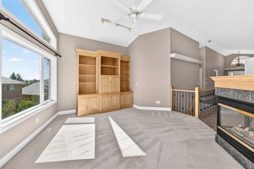 311 Royal Crest Bay Nw, Calgary, AB - Indoor With Fireplace