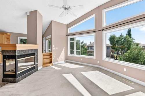 311 Royal Crest Bay Nw, Calgary, AB - Indoor With Fireplace