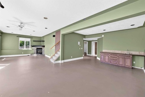 311 Royal Crest Bay Nw, Calgary, AB - Indoor With Fireplace