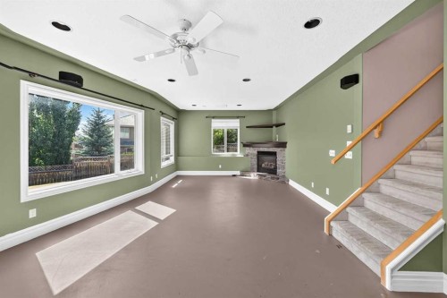 311 Royal Crest Bay Nw, Calgary, AB - Indoor With Fireplace