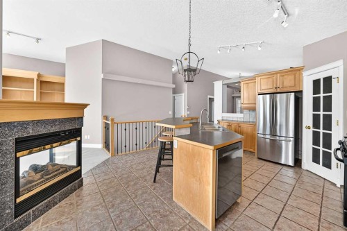 311 Royal Crest Bay Nw, Calgary, AB - Indoor With Fireplace