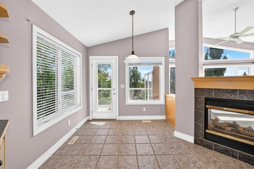 311 Royal Crest Bay Nw, Calgary, AB - Indoor With Fireplace