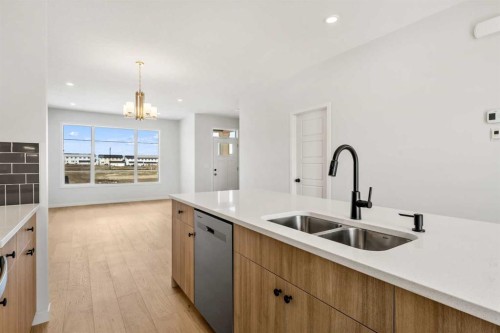 659 Chelsea Pier Run, Chestermere, AB - Indoor Photo Showing Kitchen With Double Sink