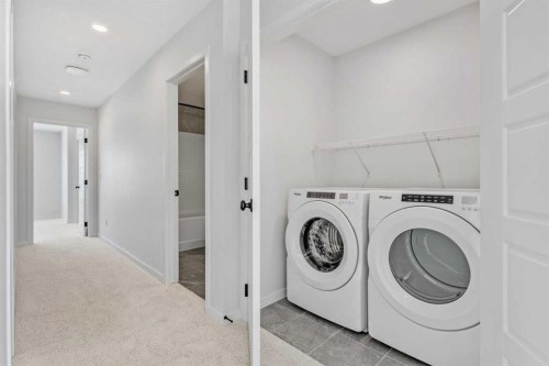 659 Chelsea Pier Run, Chestermere, AB - Indoor Photo Showing Laundry Room