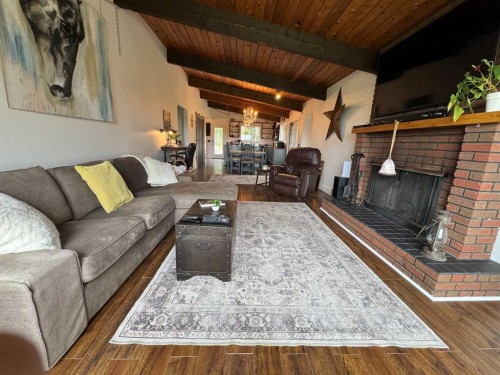 33374 Range Road 55, Rural Mountain View County, AB - Indoor Photo Showing Living Room With Fireplace