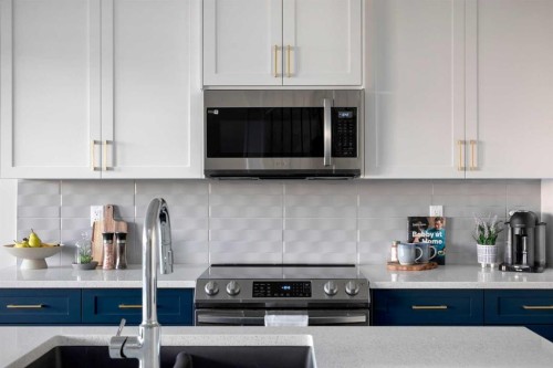 79 Waterford Mews, Chestermere, AB - Indoor Photo Showing Kitchen With Upgraded Kitchen