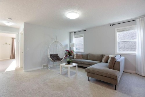 213 Kingsmere Cove Se, Airdrie, AB - Indoor Photo Showing Living Room