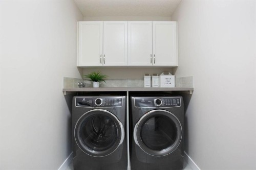 213 Kingsmere Cove Se, Airdrie, AB - Indoor Photo Showing Laundry Room