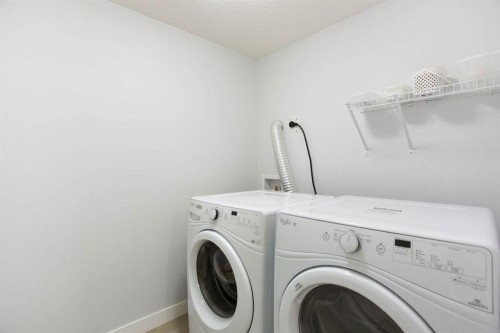213 Kingsmere Cove Se, Airdrie, AB - Indoor Photo Showing Laundry Room