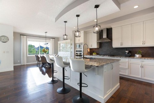 213 Kingsmere Cove Se, Airdrie, AB - Indoor Photo Showing Kitchen With Upgraded Kitchen