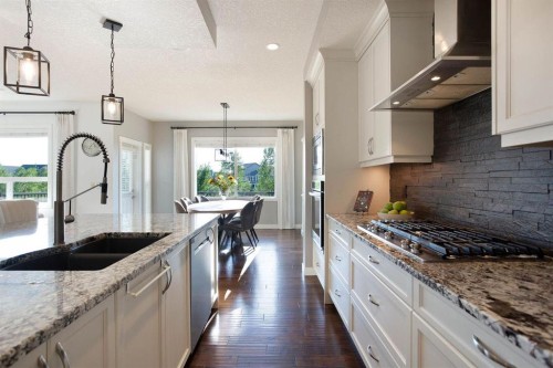 213 Kingsmere Cove Se, Airdrie, AB - Indoor Photo Showing Kitchen With Double Sink With Upgraded Kitchen