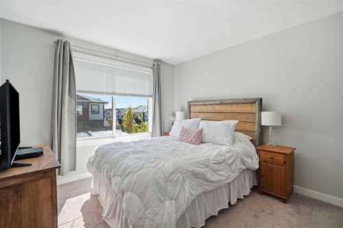 204 Jumping Pound Common, Cochrane, AB - Indoor Photo Showing Bedroom