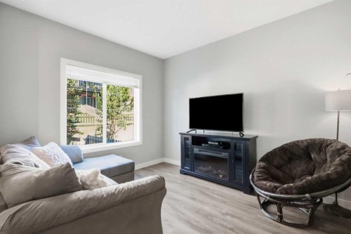 204 Jumping Pound Common, Cochrane, AB - Indoor Photo Showing Living Room