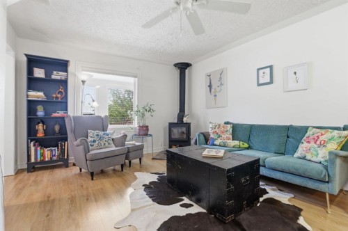 2912 17 Street Se, Calgary, AB - Indoor Photo Showing Living Room With Fireplace