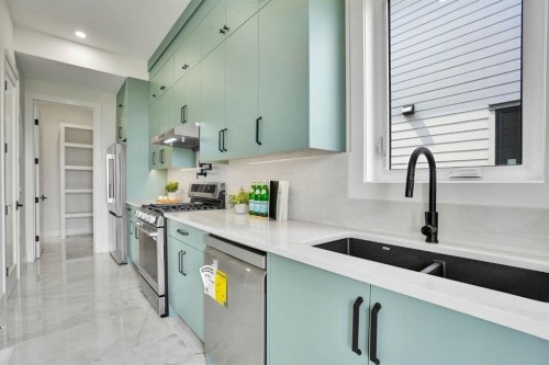 952 South Shore Terrace, Chestermere, AB - Indoor Photo Showing Kitchen With Double Sink With Upgraded Kitchen