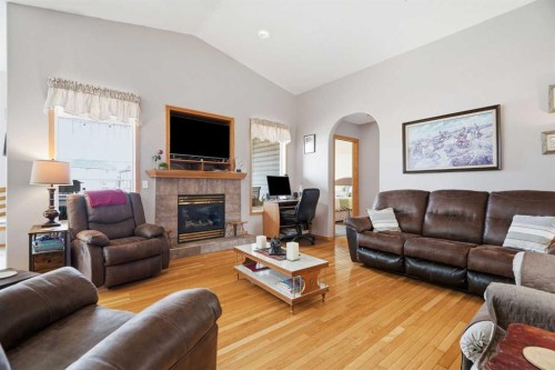 1706 3 Avenue Se, High River, AB - Indoor Photo Showing Living Room With Fireplace