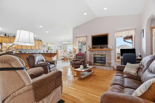 1706 3 Avenue Se, High River, AB - Indoor Photo Showing Living Room With Fireplace