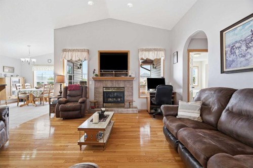 1706 3 Avenue Se, High River, AB - Indoor Photo Showing Living Room With Fireplace