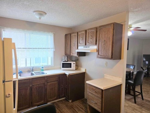 709 Hammond Drive South, Fox Creek, AB - Indoor Photo Showing Kitchen With Double Sink