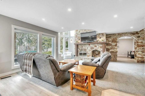 601 East Chestermere Drive, Chestermere, AB - Indoor Photo Showing Living Room With Fireplace