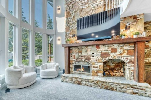 601 East Chestermere Drive, Chestermere, AB - Indoor Photo Showing Living Room With Fireplace