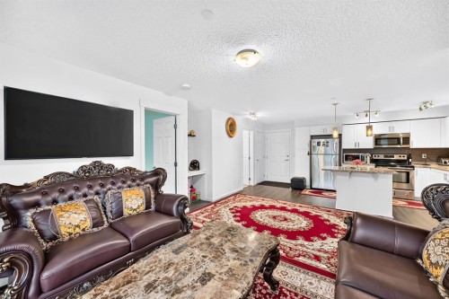 4310-755 Copperpond Boulevard Se, Calgary, AB - Indoor Photo Showing Living Room